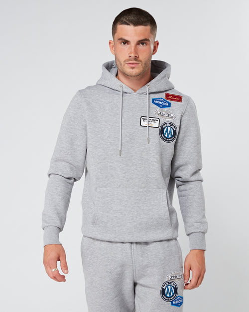 Grey Marl dhe Badge Hoodie.